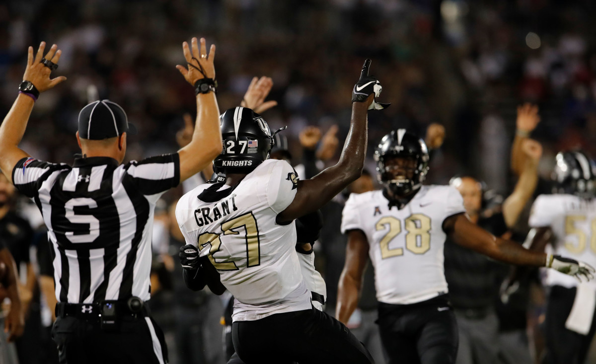 Grant (27) celebrates with teammates after intercepting a pass. Mandatory Credit: David Butler II-USA TODAY Sports
